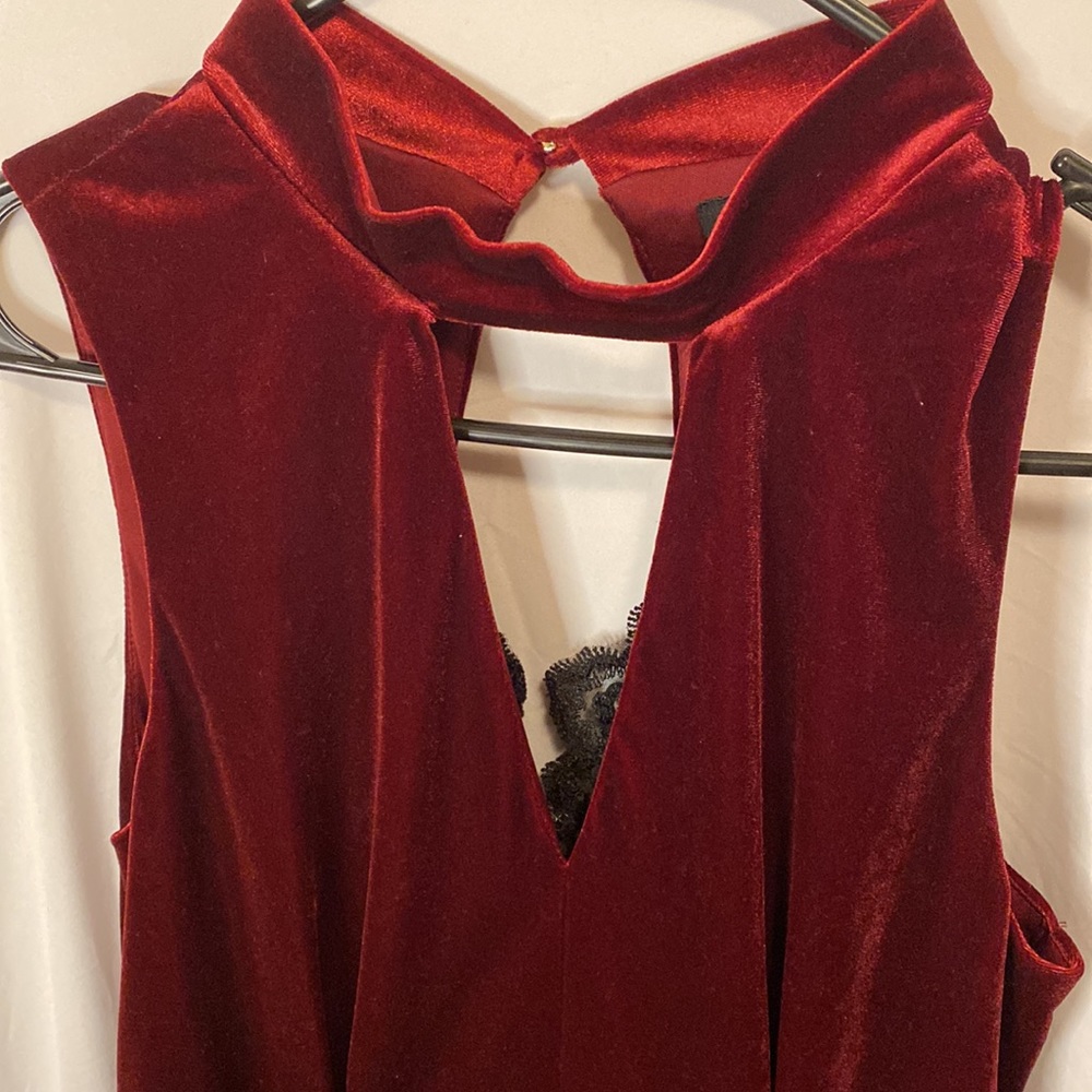 Burgundy velvet jumpsuit.